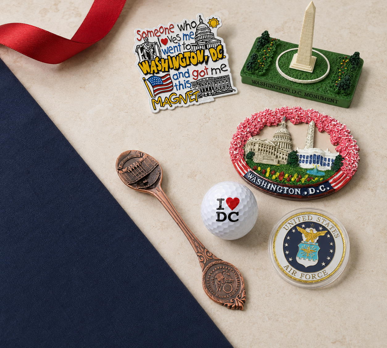 Affordable Washington DC gifts under $10, including magnets, a souvenir spoon, golf ball, Air Force coin and Washington Monument replica.