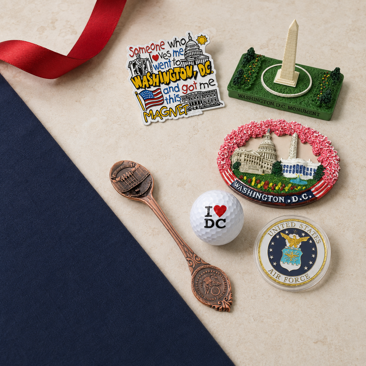 Affordable Washington DC gifts under $10, including magnets, a souvenir spoon, golf ball, Air Force coin and Washington Monument replica.