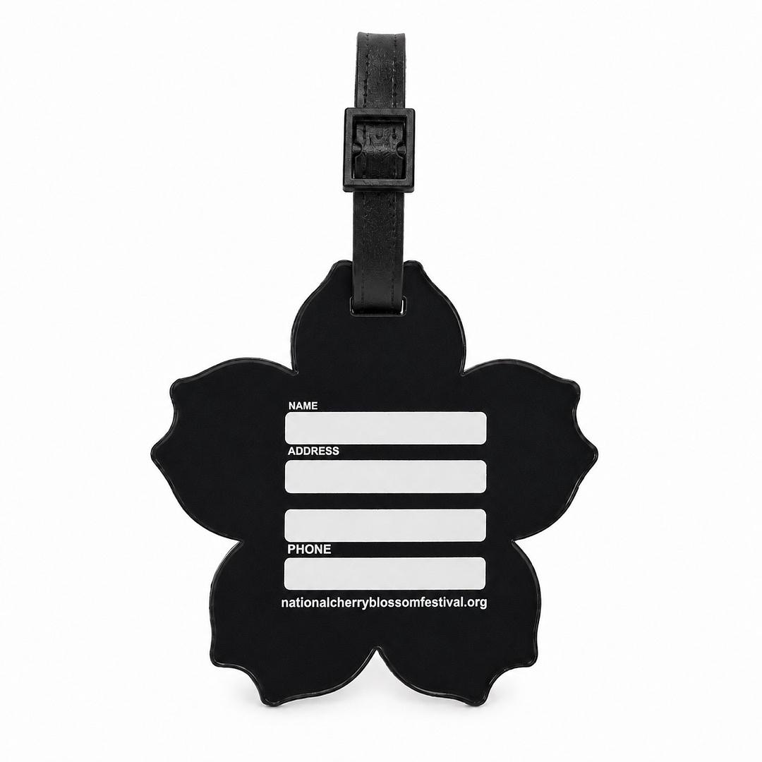 A black cherry blossom-shaped luggage tag with a black strap and white text fields for name, address, and phone, along with the website nationalcherryblossomfestival.org, shown on a plain white background.