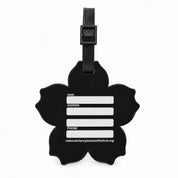 A black cherry blossom-shaped luggage tag with a black strap and white text fields for name, address, and phone, along with the website nationalcherryblossomfestival.org, shown on a plain white background.