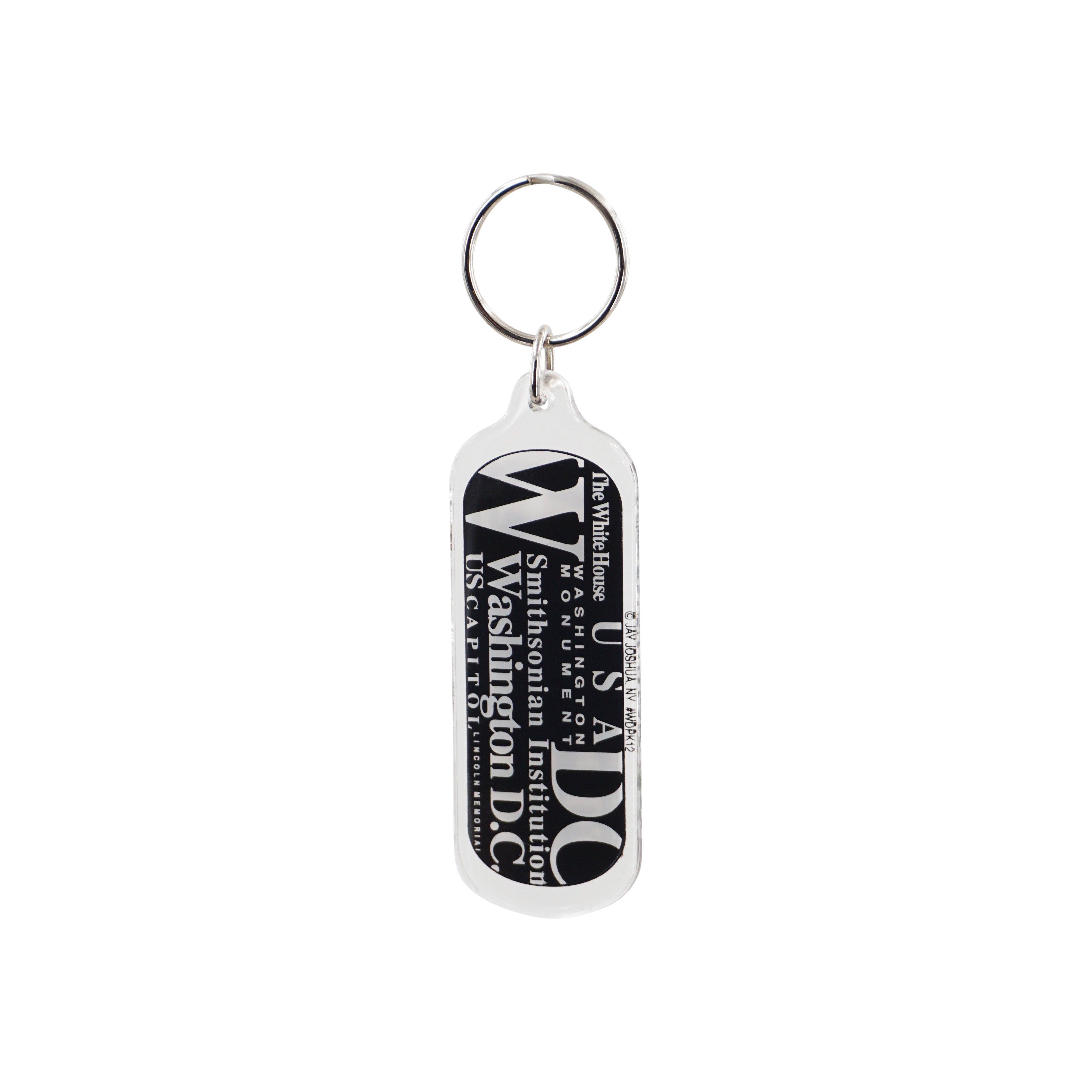 Black-and-white Washington DC typography keychain featuring the White House, U.S. Capitol, Smithsonian Institution, and Lincoln Memorial.