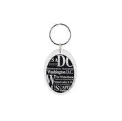 Oval Washington DC souvenir keychain with black-and-white typography featuring the White House, U.S. Capitol, Smithsonian Institution, Lincoln Memorial, and Washington Monument.