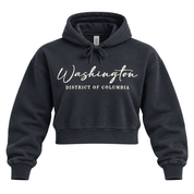 A dark charcoal gray cropped hoodie with 'Washington' and 'DISTRICT OF COLUMBIA' printed in white on the front, displayed on a clean white background.