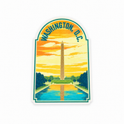 A die-cut sticker featuring a stylized illustration of the Washington Monument in Washington, D.C.