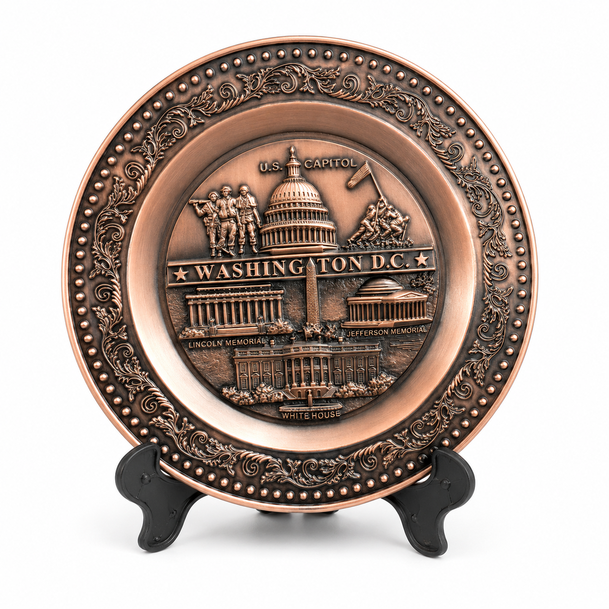 A copper metal plate with a detailed image of the Washington Monument and surrounding landmarks, displayed on a stand.