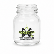 A clear glass jar with a threaded neck and a printed graphic on the front reading 'MOONSHINE' and 'BEST CURE FOR AN AILING CONGRESS' in black and neon green.