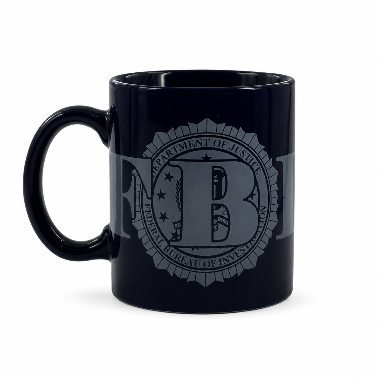 A glossy black ceramic mug featuring a gray printed seal of the Federal Bureau of Investigation (FBI) on the side, set against a plain white background.