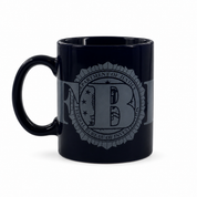 A glossy black ceramic mug featuring a gray printed seal of the Federal Bureau of Investigation (FBI) on the side, set against a plain white background.