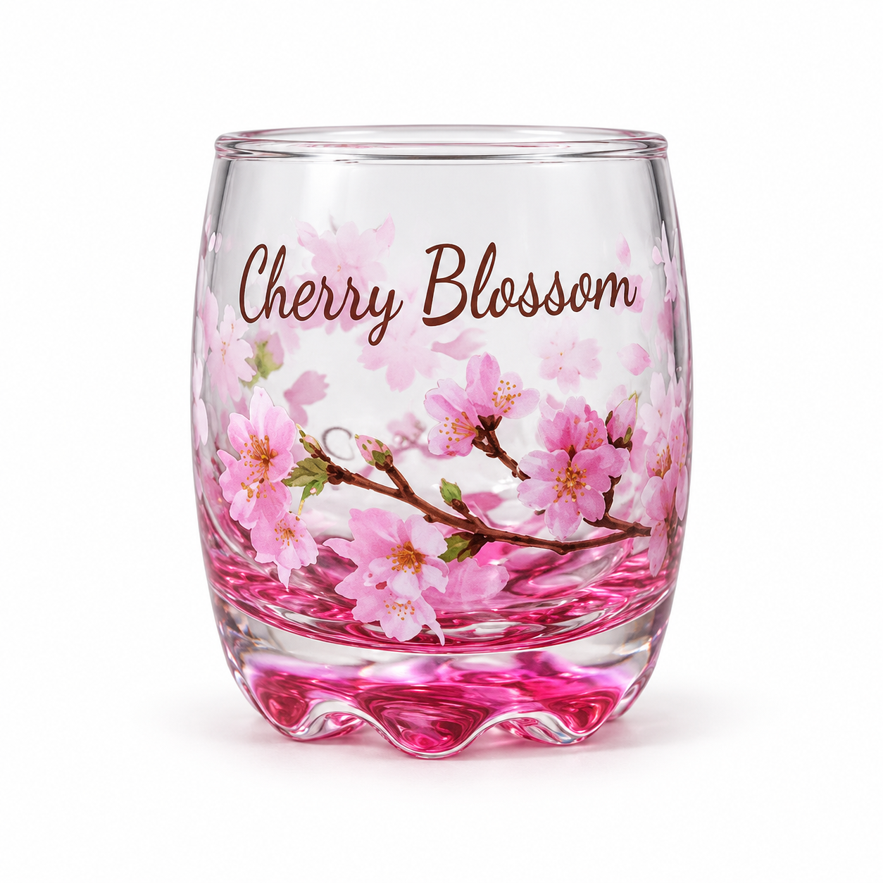 A clear stemless glass tumbler with pink cherry blossom illustrations and the words 'Cherry Blossom' printed on it, shown on a white background.
