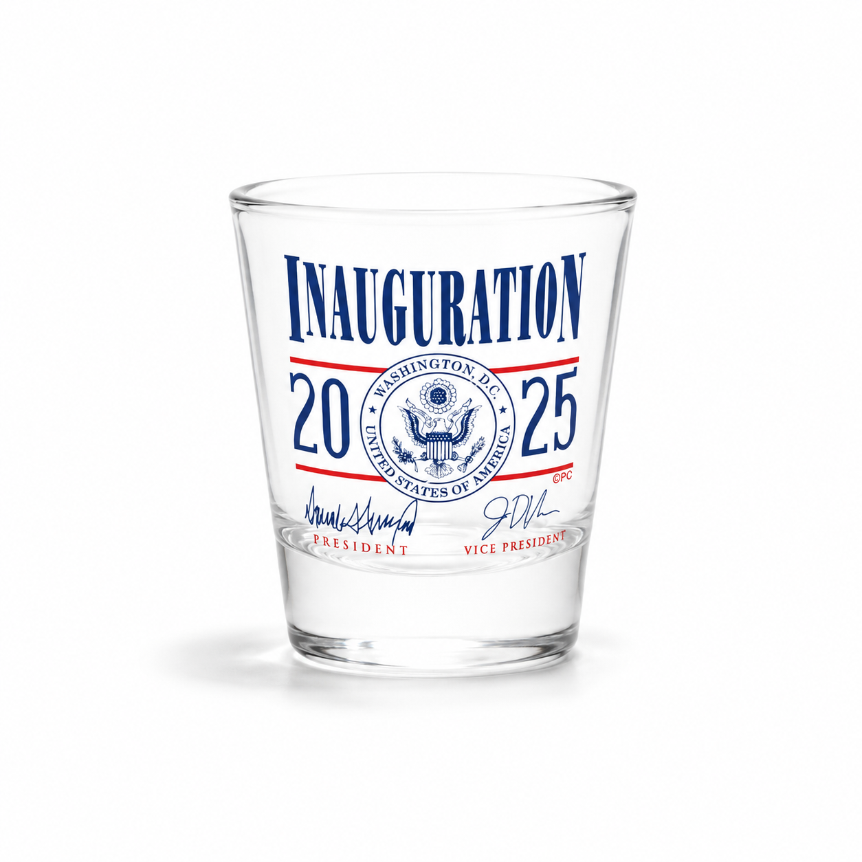 A clear glass shot glass featuring Donald Trump Signature and  a printed inaugurations 202 U.S.