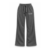 Dark gray wide-leg sweatpants with an elastic drawstring waist and a small white script logo on the left hip, shown against a plain white background.