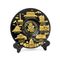 Decorative plate with gold illustrations of U.S. landmarks on a black background