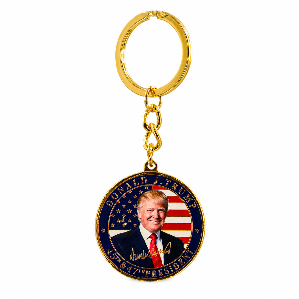 A gold-colored metal keychain featuring a round medallion with Donald J. Trump's portrait, a U.