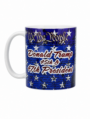 A white ceramic mug featuring a blue and white patriotic graphic with the text 'Donald Trump 45th & 47th President' and 'We the People' with stars.
