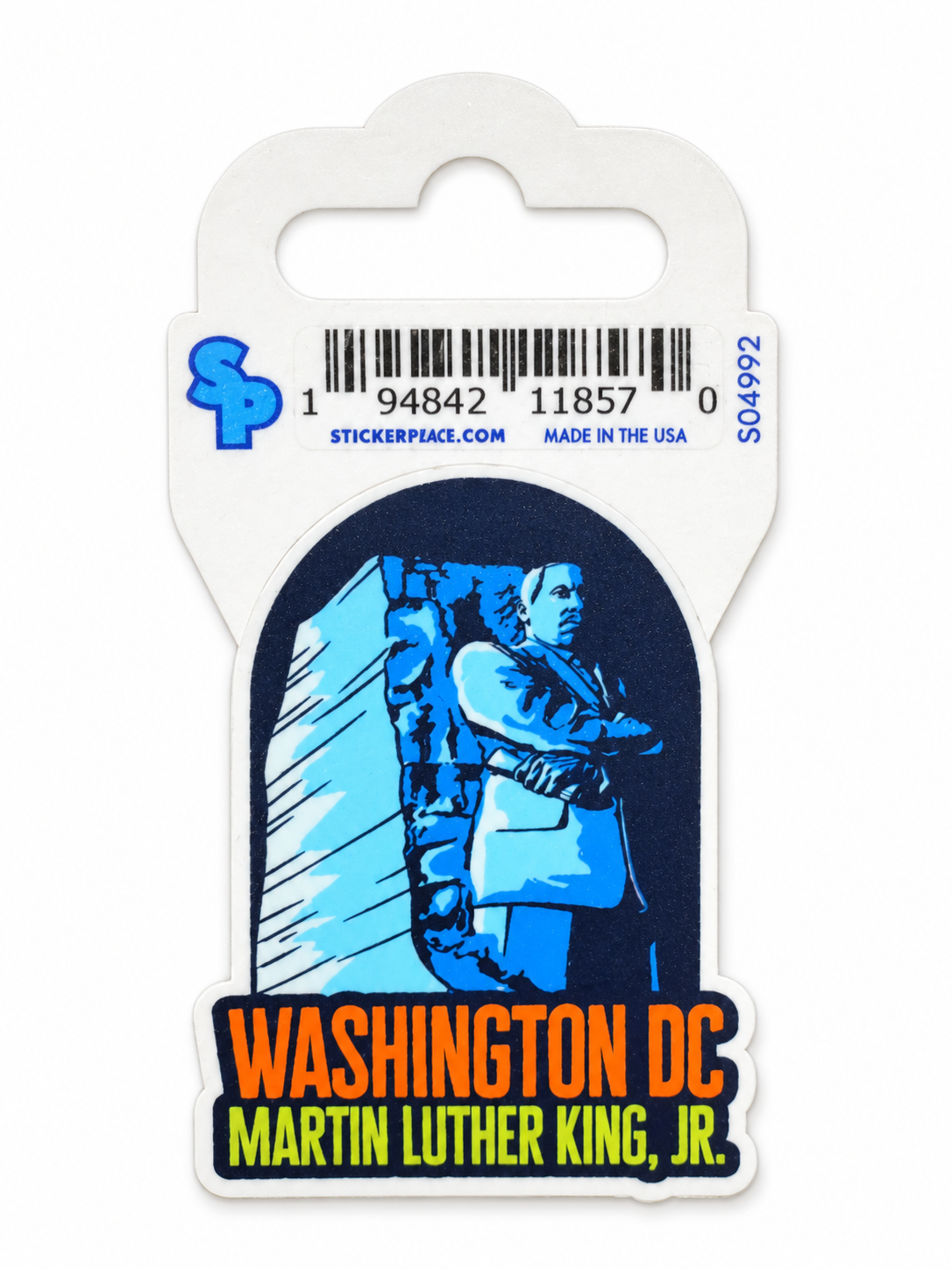 A sticker of Martin Luther King, Jr. in Washington DC, mounted on its original white cardboard backing with a barcode and product details.