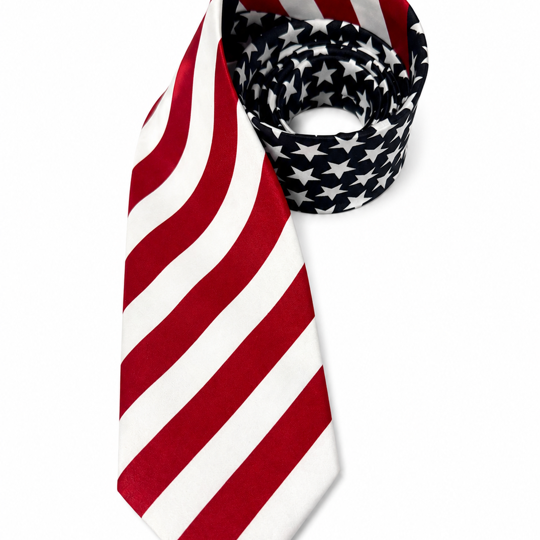 Red and white striped tie with a dark navy and white patterned bow tie on a white background