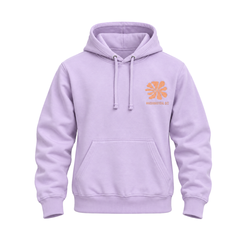 A pale lavender pullover hoodie with a small orange flower-like graphic and the text 'Washington DC on the left chest, shown on a plain white background.