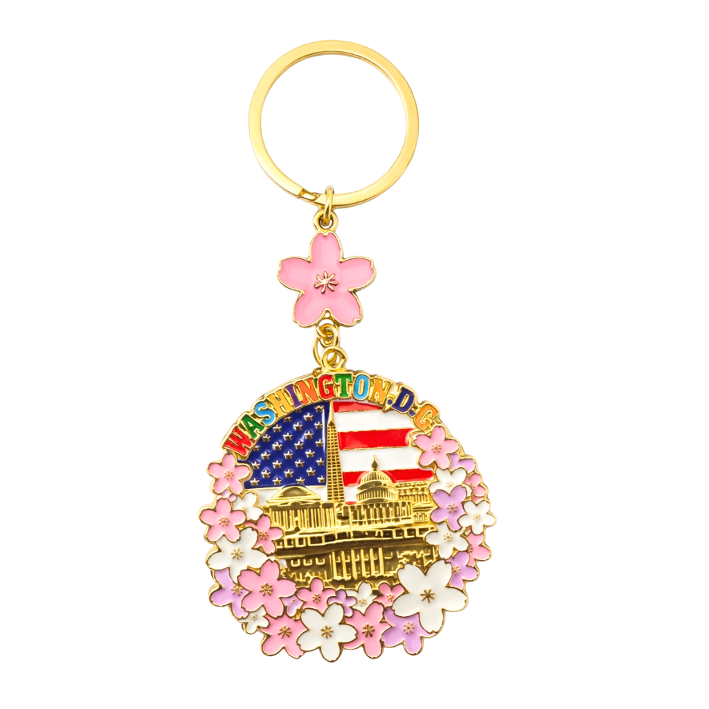 Patriotic Washington DC cherry blossom keychain featuring the American flag, U.S. Capitol, Washington Monument, and pink floral border.