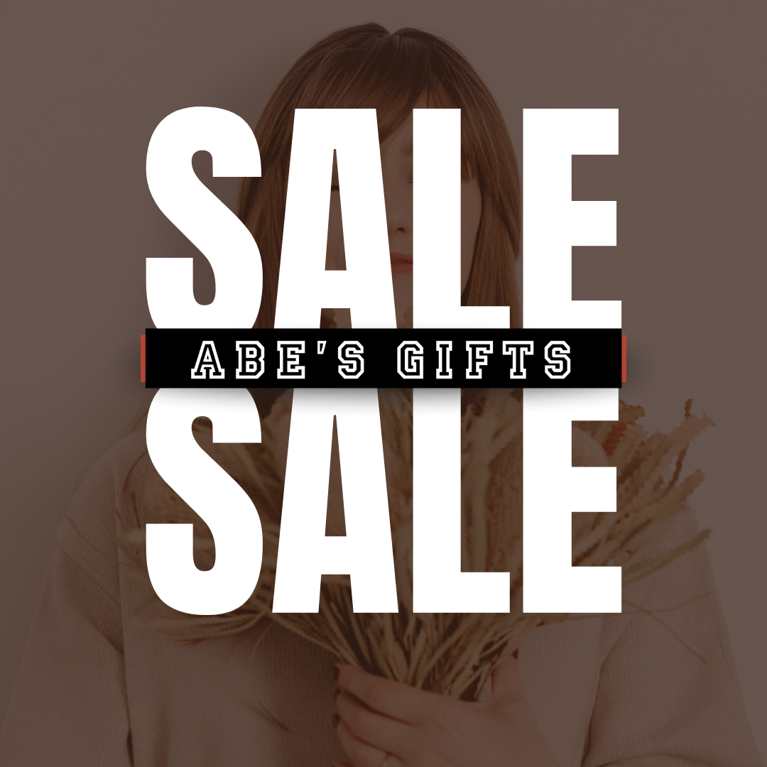 A promotional sale graphic with large white 'SALE' text over a sepia-toned photo of a woman holding dried grass, with a black banner reading 'ABE'S GIFTS' across the center.