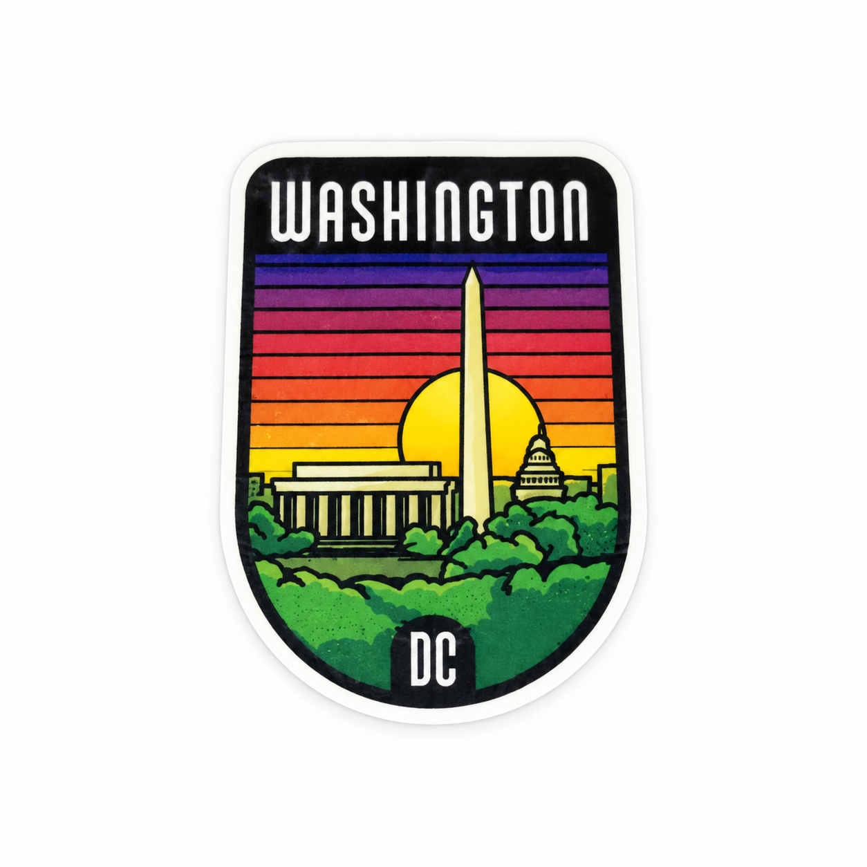 A die-cut sticker featuring a colorful Washington, DC skyline with the Washington Monument, Lincoln Memorial, and Capitol building against a sunset gradient, with 'WASHINGTON' at the top and 'DC' at the bottom.