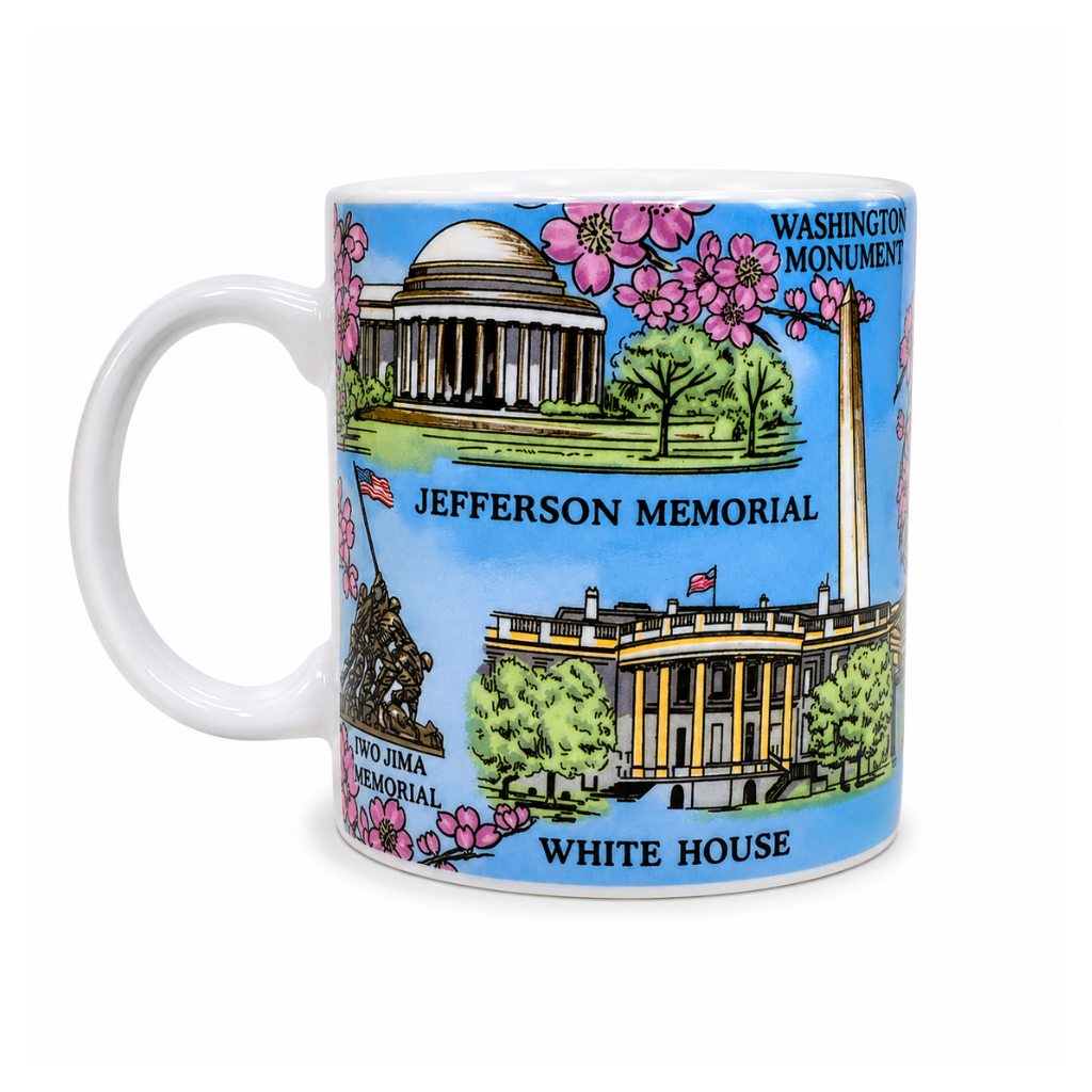 Washington DC cherry blossom coffee mug featuring the Jefferson Memorial, White House, Washington Monument, and Iwo Jima Memorial with blooming pink cherry blossoms.