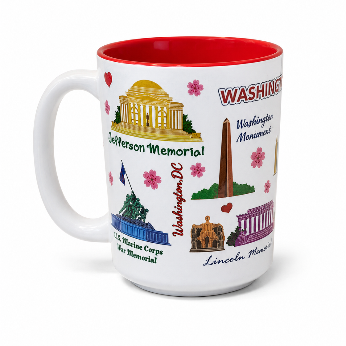 A Washington DC souvenir white ceramic coffee mug with a red interior rim, decorated with illustrations of the Jefferson Memorial, US Marine Corps War Memorial, Washington Monument and Lincoln Memorial.