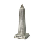 Metallic model of a tower with 'Monument' branding on a white background