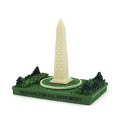 Model of the Washington Monument on a green base with 'Washington D.C. Monument' text.