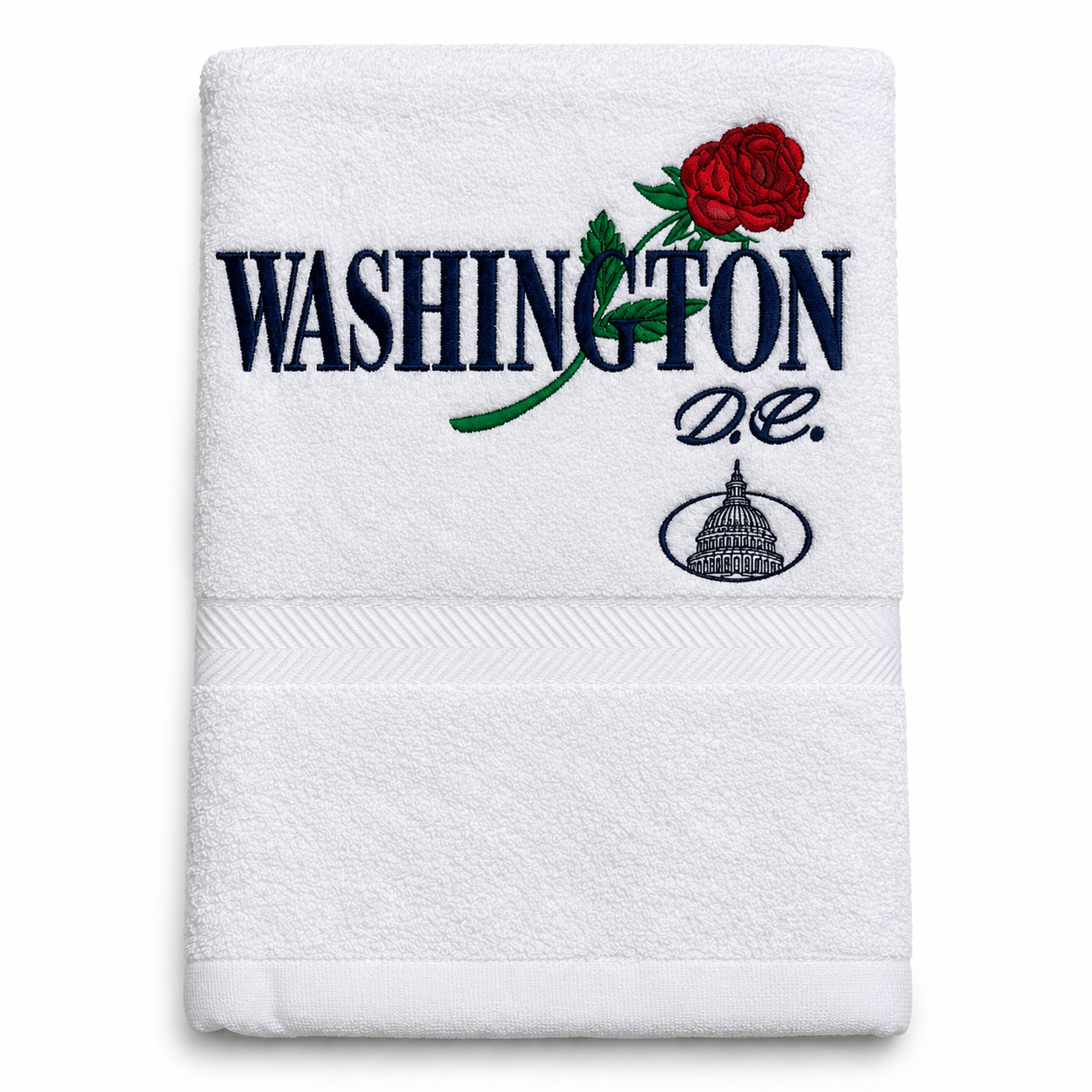 A white cotton hand towel featuring embroidered navy blue text reading 'WASHINGTON D.C.