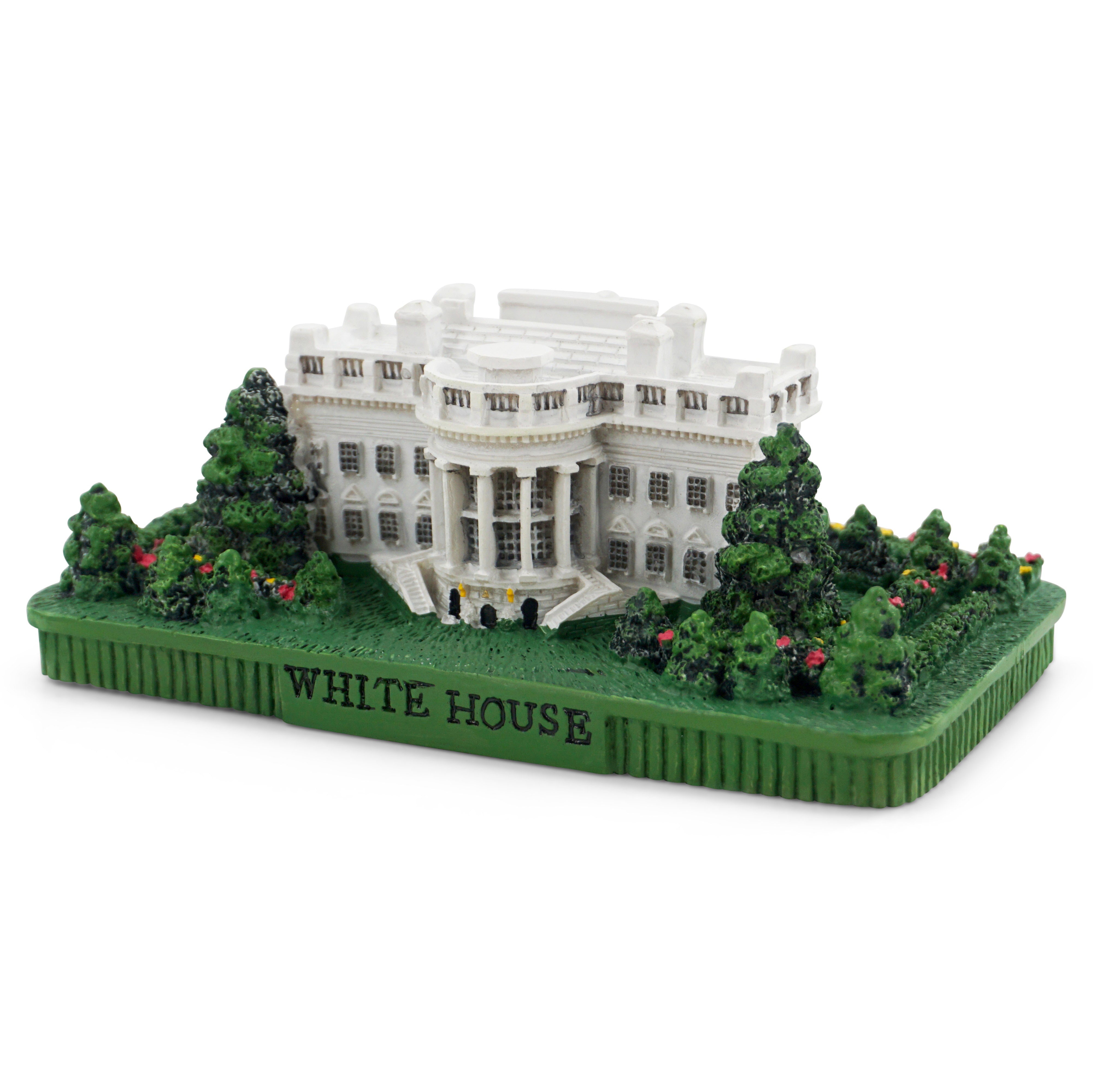 Model of the White House with green base and trees on a white background