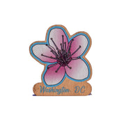 Flower-shaped magnet with 'Washington, D.C.' text on a white background