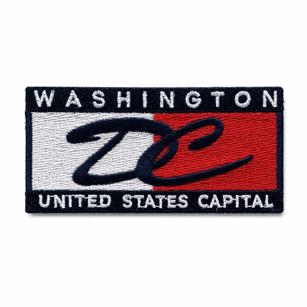 An embroidered rectangular patch featuring the text 'WASHINGTON UNITED STATES CAPITAL' with a large stylized 'DC' over a red, white, and navy blue background.