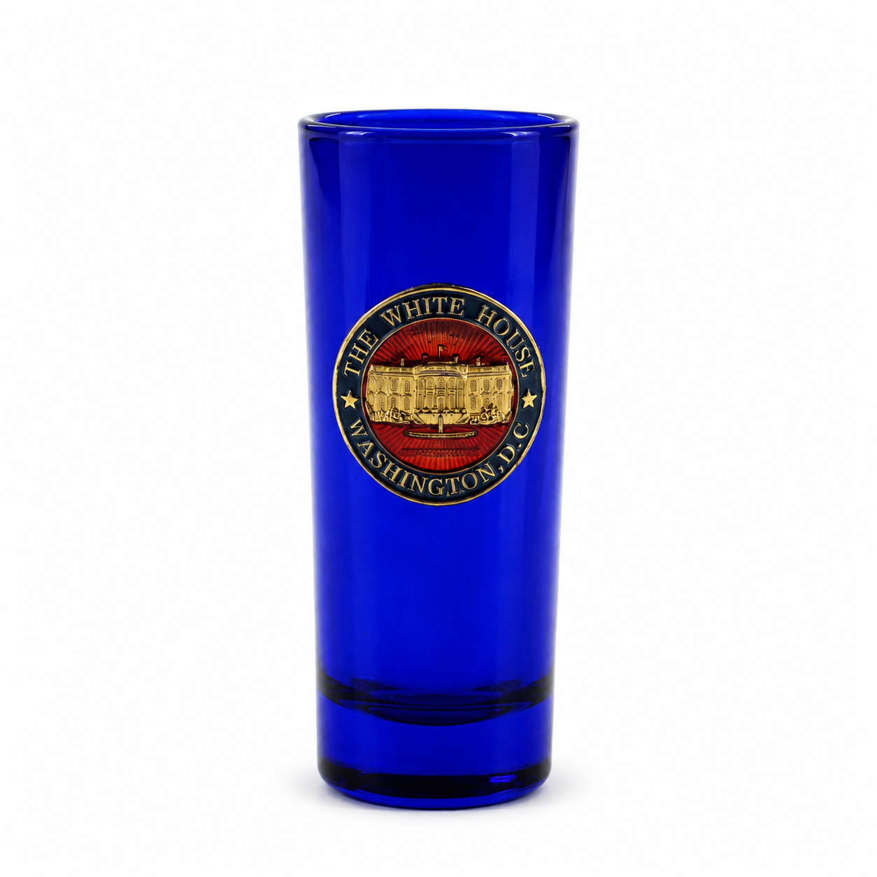 A cobalt blue glass tumbler featuring a circular 'The White House Washington DC' emblem printed on the front, set against a plain white background.
