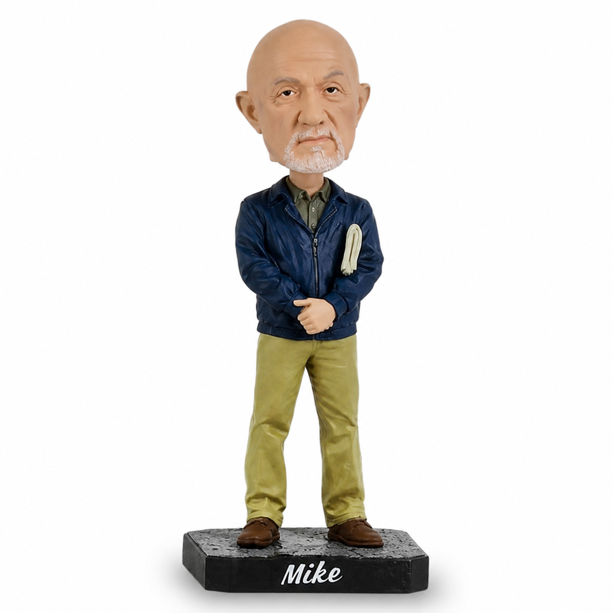 A custom-painted bobblehead figurine of an older bald man with a white beard, wearing a navy blue zip-up jacket, olive green shirt, khaki pants, and brown shoes. The figure stands on a black base labeled 'Mike'.