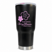 A black insulated travel tumbler with a clear lid, featuring a pink cherry blossom graphic and the text 'National Cherry Blossom Festival' printed on the front. The tumbler has a brushed silver metal base.