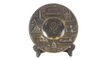 A pewter plate featuring the U.S. Seal in the center with various landmarks of Washington, D.C. around it.