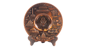 A bronze-colored copper metal plate with a detailed depiction of the U.S.