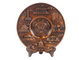 Bronze decorative plate with embossed designs on a white background